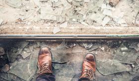 Brown boots standing on broken glass