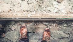 Brown boots standing on broken glass